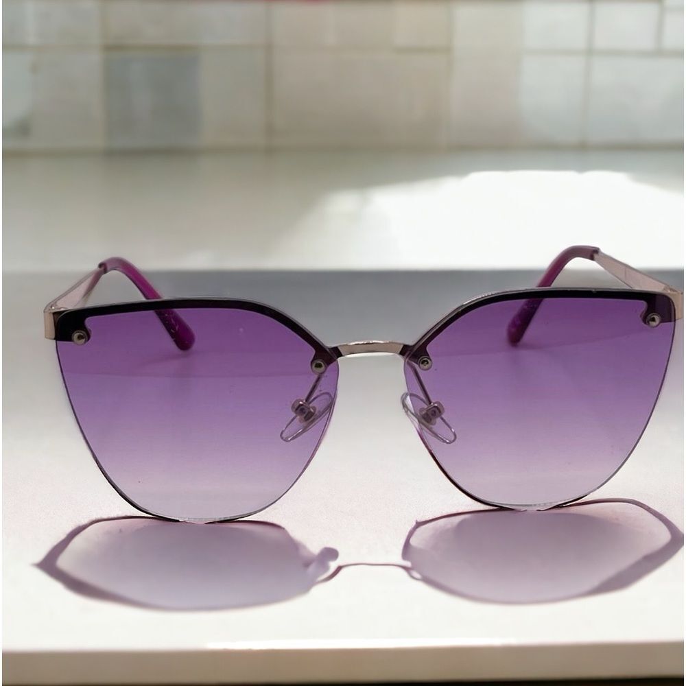 Rimless pink/purplish lens sunglasses oversized